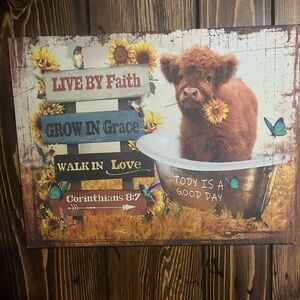 Highland cow with quite sighn